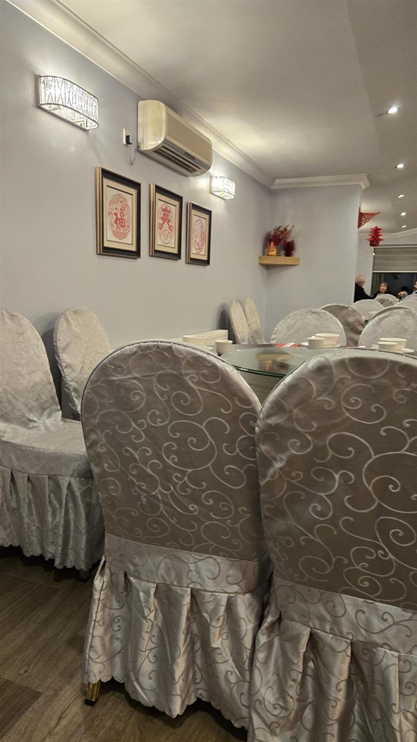A view of the restaurant's dining area, showing tables at a standard dining chair height.