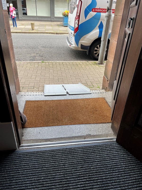 The shop entrance with a ramp outside