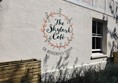 Skylark Café logo on their exterior wall.