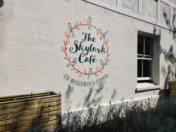 Skylark Café logo on their exterior wall.