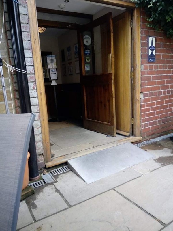 Picture of a wide door with a ramp