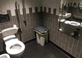Image of the accessible toilet showing the toilet and the transfer space.