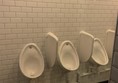 Image of three urinals