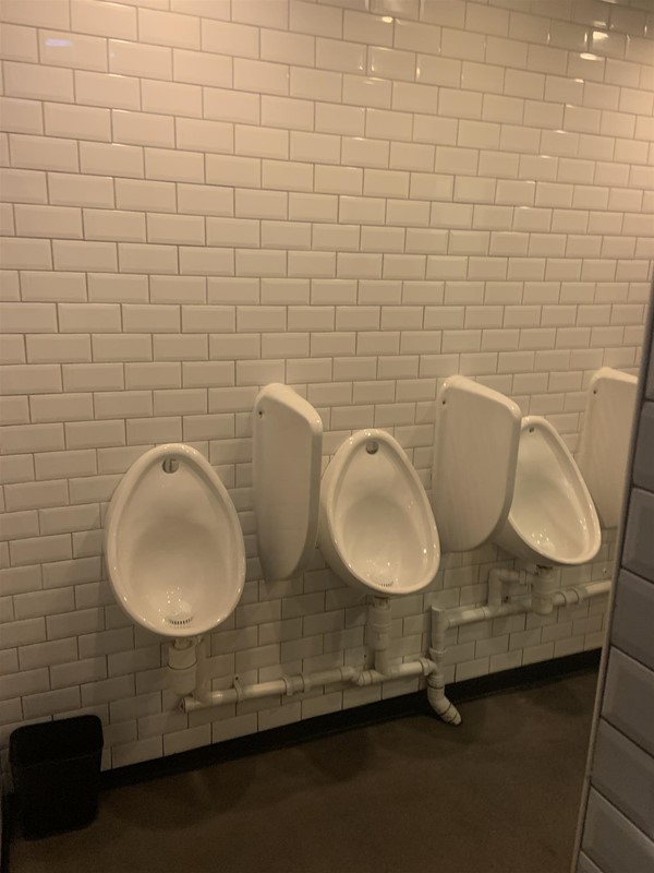Image of three urinals