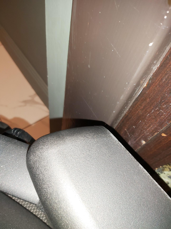 Space between my chair and the doorframe on the right.