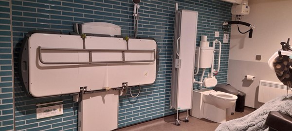 Image of a Changing Places toilet with changing table and hoist