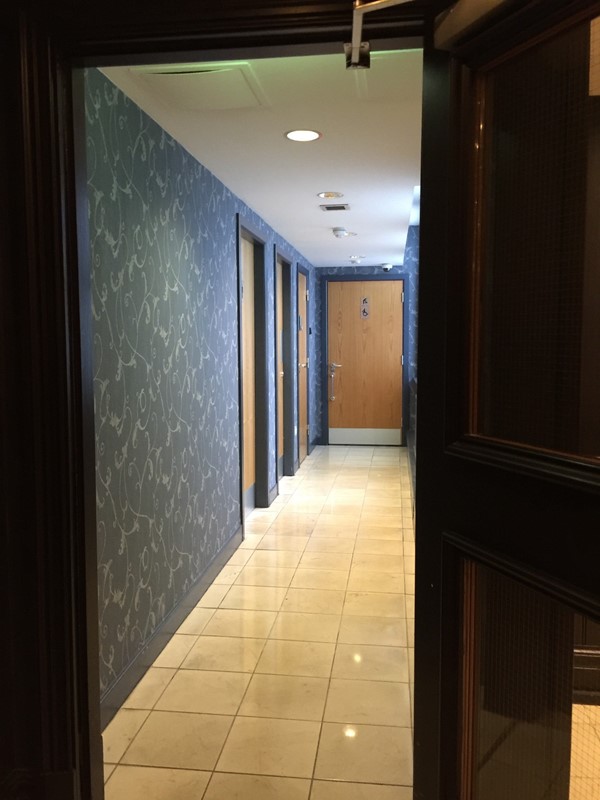 The corridor to the toilets adjacent to the bar and restaurant.