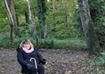 Picture of a powerchair user in a wood