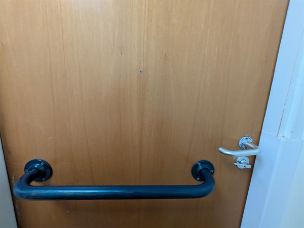 image of inside of door of accessible bathroom Jubilee wing
