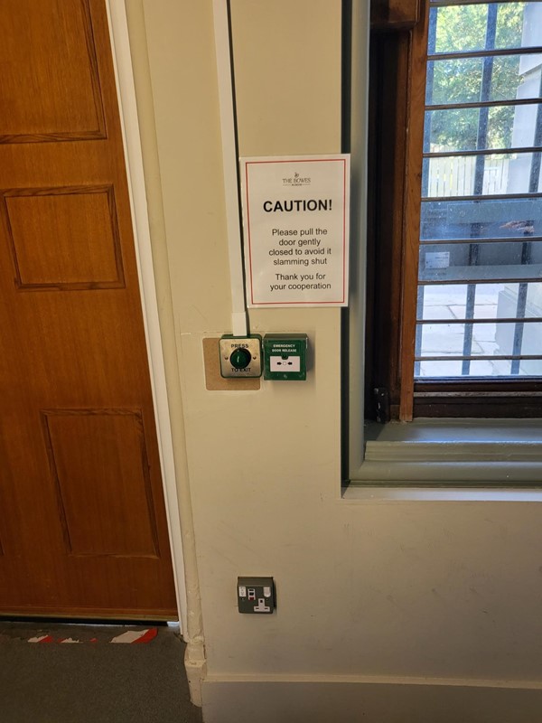 Picture of a sign advising you not to slam a door