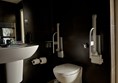Image of a bathroom with grabrails
