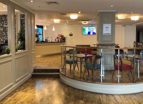 The bar, but it has two steps to get up whichever way you go
