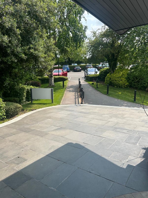 Looking back toward disabled parking and carpark