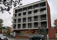 MICs Sant Jordi exterior photo. Showing metro station outside and ramp access into apartment building.