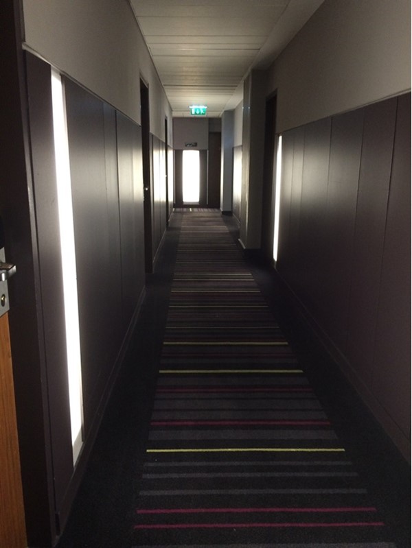 A corridor from the lift to the bedrooms