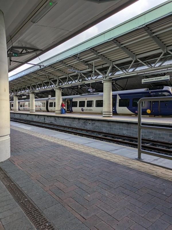 Image of the train station platform, there are tactile markings at the platform edge
