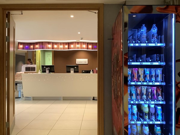 Picture of a vending machine and a reception desk