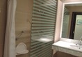 Bathroom with walk in shower, grab rail and seat