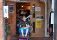 Powerchair user in doorway