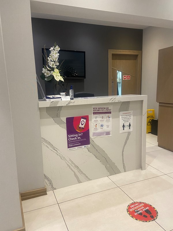Hotel reception with social distance Markers