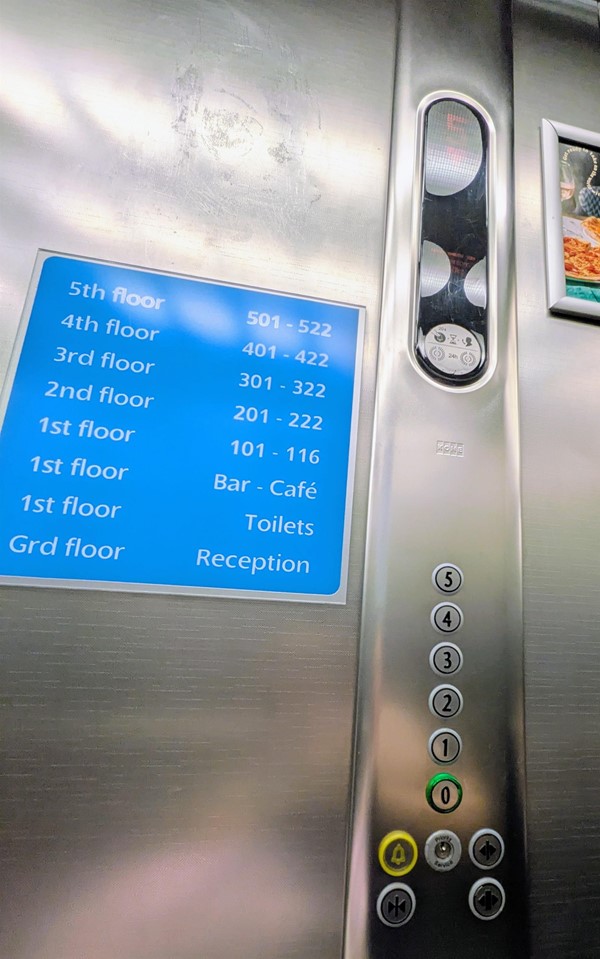 Image of lift button panel and signage