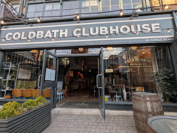 Image of venue exterior, above the door are the words "COLDBATH CLUBHOUSE" - white text on a grey sign.