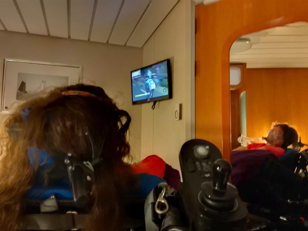 Image of a wheelchair user in watching a television
