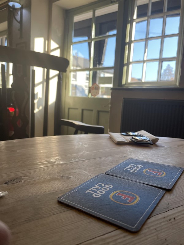 Image of twoo beer mats on a table