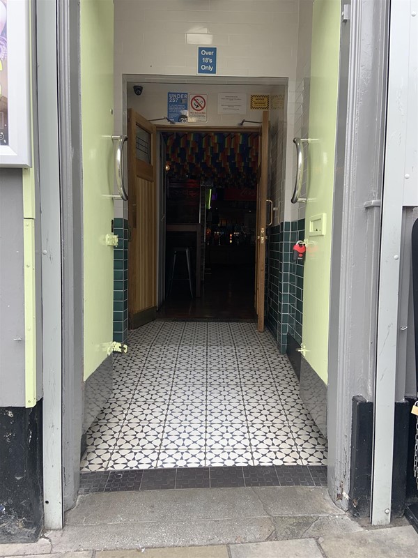 Image of a corridor going to double doors