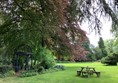 Picture of a picnic bench in a field