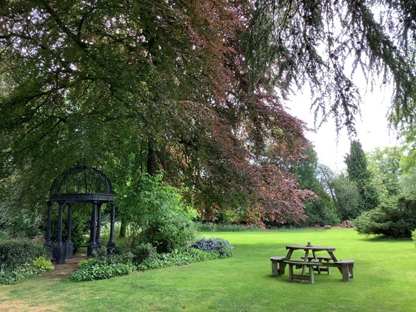 Picture of a picnic bench in a field