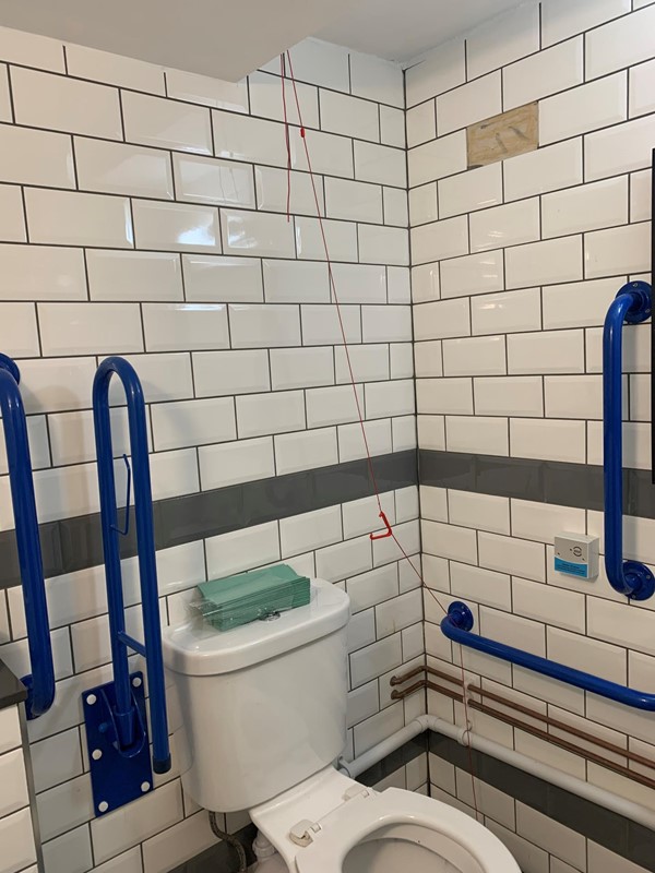 Cord tied up, but there are grab rails