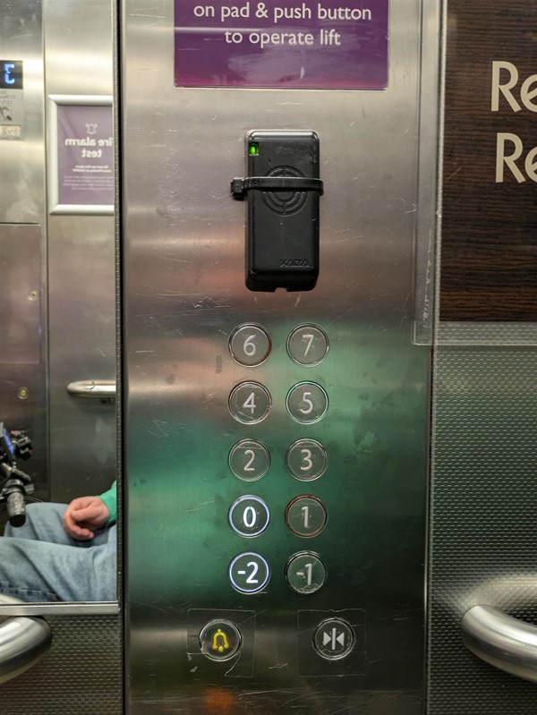 Image of lift buttons. The lift buttons do not have Braille Markings