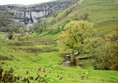 View of Malham Cove with the stream running along the valley.