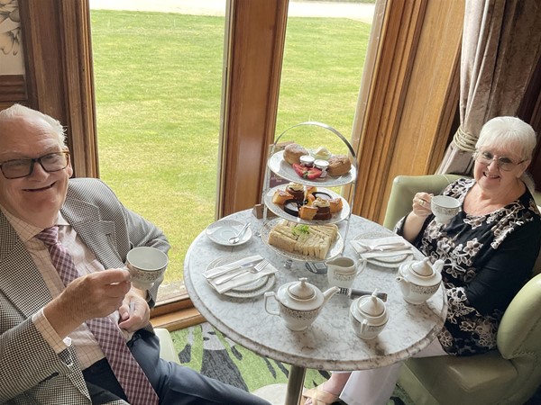Image of two people seated at a table