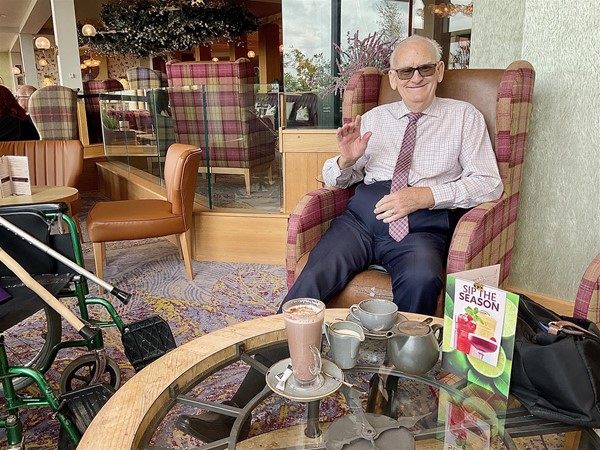 Image of a person sat at a table