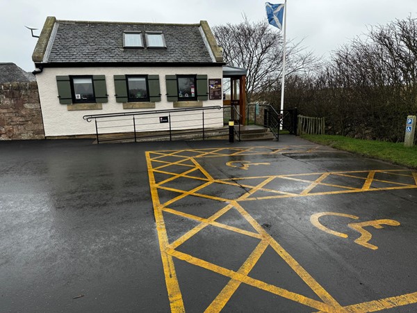 Disabled parking, ramp entry to visitor reception  (side gate at right of building)