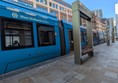 image of tram at tram stop