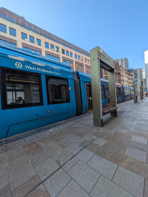 image of tram at tram stop
