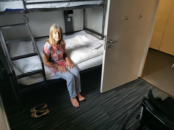 Bunk beds in accessible room. You can see the lack of space to put a wheelchair next to the bed once the bathroom door is open.