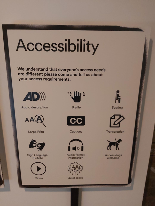Poster about accessibility and saying that the museum has audio description, braille, seating, large print, captions, transcripts, BSL, audio format information, access dogs welcome, video, quiet space.