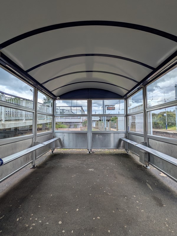 Image of  rain shelter with metal benches