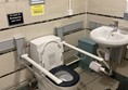 Image of an accessible toilet with grabrails