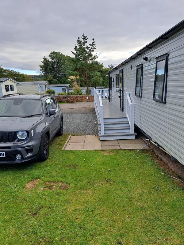 If you're not in wheelchair friendly accommodation but are partially ambulant, vans with verandahs have steps with rails on both sides. Vans without verandahs only have one (or no) rail.