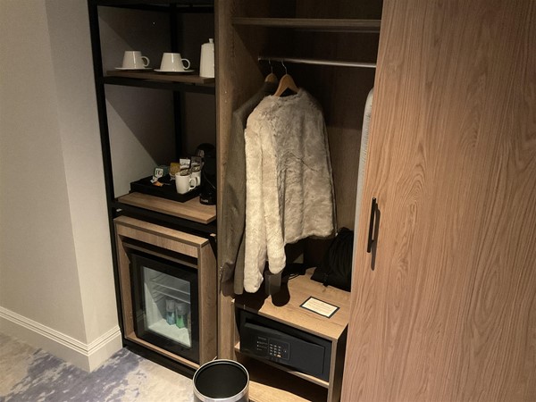 Image of a minibar and a wardrobe