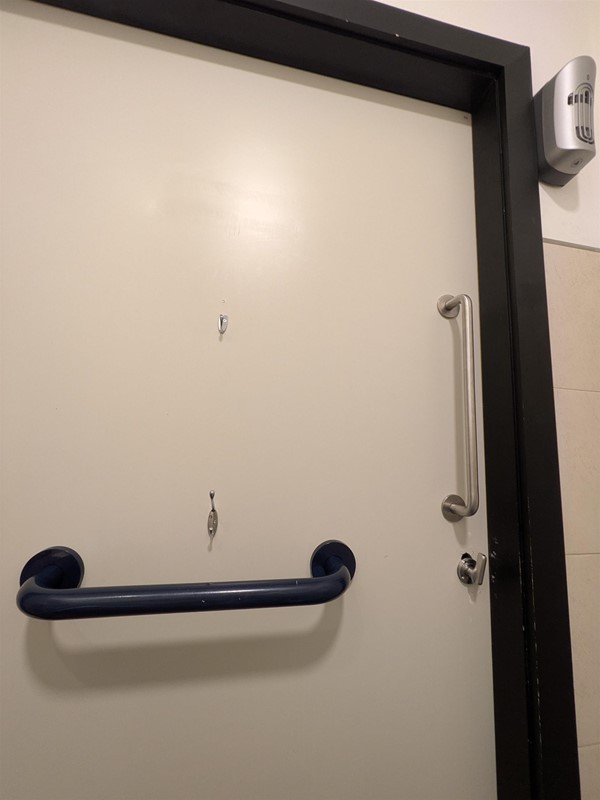 image of the inside of the door to the right accessible bathroom on the first floor