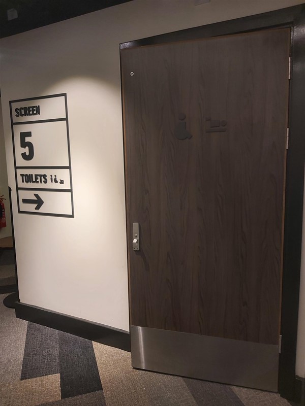 Image of a door with a sign on the wall