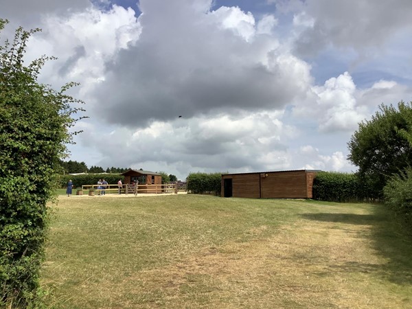 Field with wooden huts