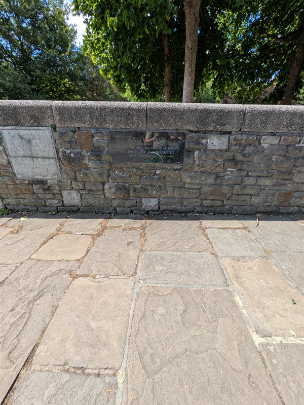 Image of path and brick wall