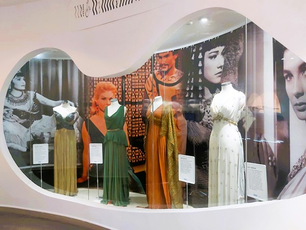Image of a display of dresses in a display case